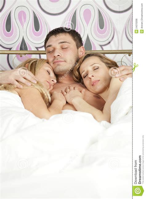 I lost my mother when i was young, she left me and my dad to live together with each other. Sleeping Man With Two Women Stock Photo - Image of couple ...