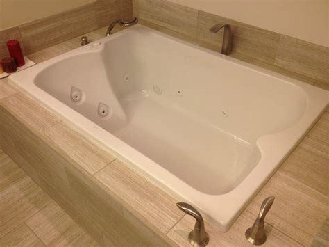 Some whirlpool tubs or spas have a finished side or two, so framing and finishing the side panel check the whirlpool's instructions and local codes. Whirlpool tub, brushed nickle Kohler fixtures with hand ...