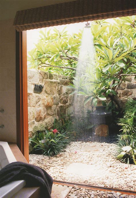 Have you seen their homes? Beach House life+style - A private outdoor shower with a ...