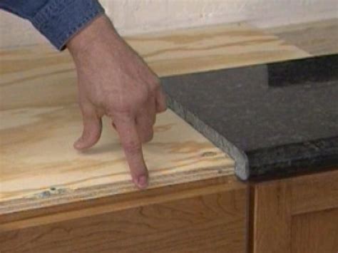 You only need the help of a few muscled friends to do the lifting as this material is a bit heavy. Installing a Do-It-Yourself Granite Countertop | how-tos | DIY