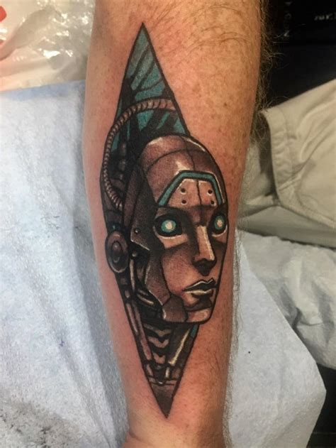 Tiki, spirals, sea shells and turtle in one tattoo design. Cyborg Head by Daniel Krantz, Tiki Tattoo, Killeen TX ...