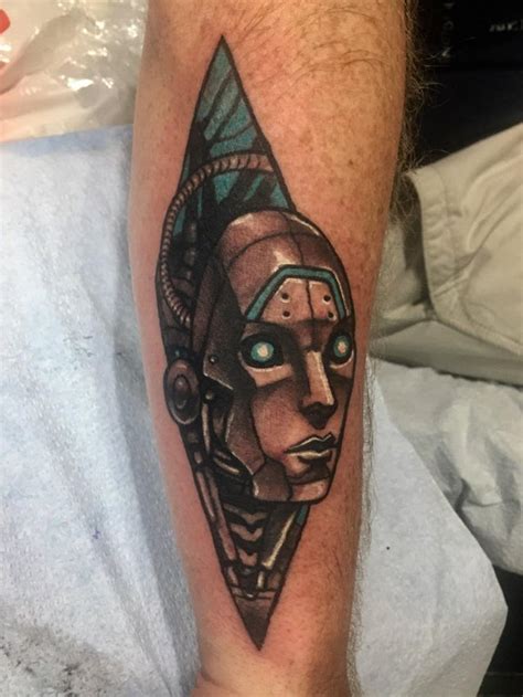 Tiki, spirals, sea shells and turtle in one tattoo design. Cyborg Head by Daniel Krantz, Tiki Tattoo, Killeen TX ...