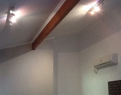 The projector is high up versus the ceiling. Lighting for high, raked ceilings