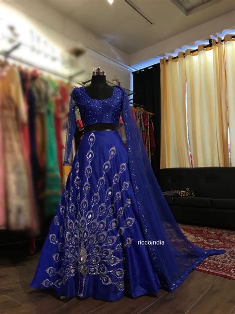 When it comes to wedding guest fashion, the editors at the knot are pretty much experts. Royal blue Lehenga with peacock embroidery done with ...