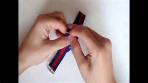 To wear a nato watch strap, put the strap on carefully. Hoe draag je een NATO strap / how to wear an NATO strap ...