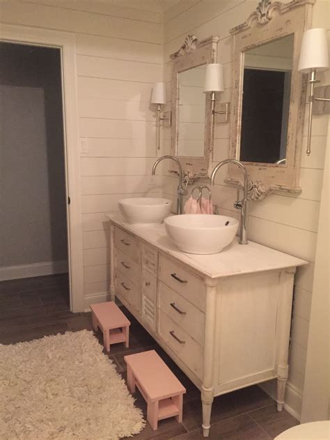 The bright blue patterned window treatments, upholstered stool cushion and the white cabinets round out the room. Perfect for little girls bathroom | Girl bathrooms, Little ...