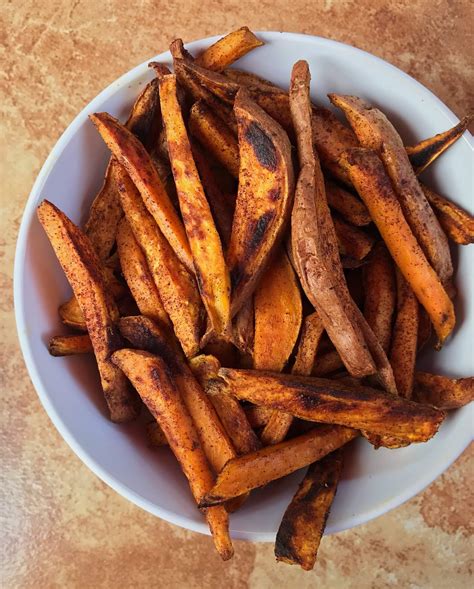 Slim cut roasted sweet potatoes with a healthy sauce for dipping! 3-Ingredient Sweet Potato Fries - Wellness for the Win