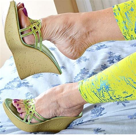 Woman posing with bare feet on chair. Pin on Foot fetish