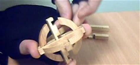 Just buy insurance first.the kind that pays out for limb loss all problems solved. Wooden Sphere Puzzle Solution