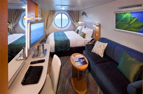 The living area has a double sofa bed, dining room, marble entry, and entertainment center. Allure Of The Seas Accommodations | Royal Caribbean Incentives