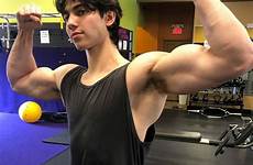 jock flexing armpits biceps