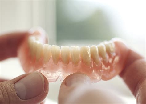 In your first lecture on complete denture prosthodontic definitions, _ is the resistance to displacement of the denture base away from the ridge. Prothèse dentaire à Joinville-le-Pont