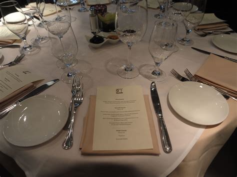 Modern classy italian restaurant dining room with white tables and red velvet cushions. A special treat for a special occasion. Book a party of 20 ...