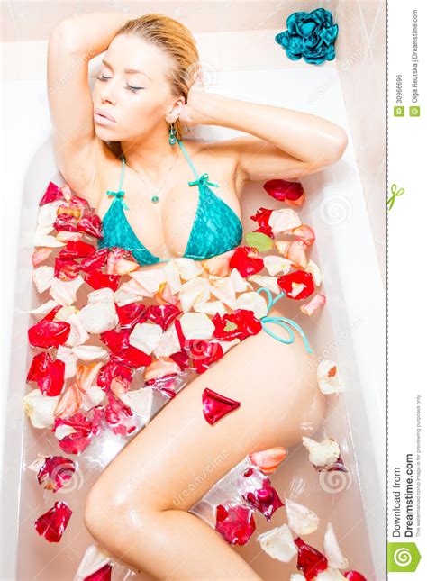50 beautiful flower meanings that will surprise you. Beautiful Blond Lady Taking A Bath With Flower Petals ...