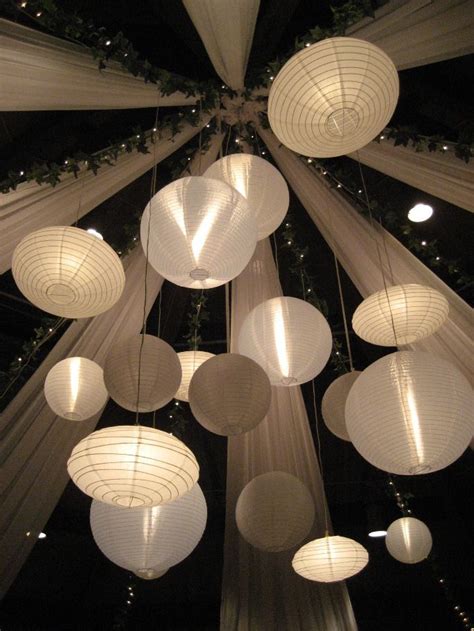 How do you hang paper flowers from the ceiling? Lantern Shot | Paper lantern lights, Hanging lanterns ...