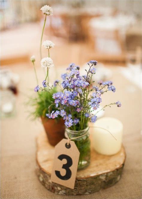 Thick hardwood slabs with beautiful wood grain make beautiful centerpieces. diy wedding centerpiece ideas | cool | Wedding table ...