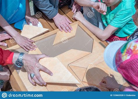 Always remember to leave spaces for larger wooden pieces. Children Play A Traditional Turkish Wooden Puzzle Game ...