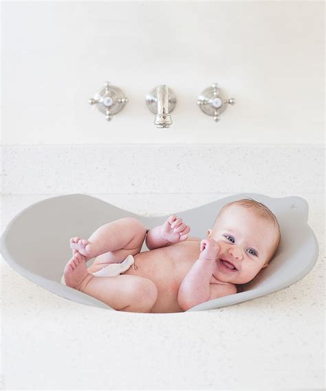 She started standing up in the bath, certain she could balance (she couldn't), or at the very least, sure she could cruise along while. Flyte Compact Infant Bath | Baby bath tub, Baby tub ...