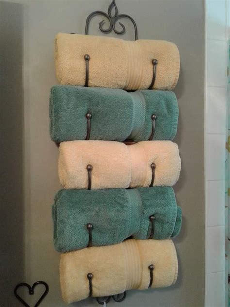 Find contemporary towel racks, toilet paper holders, shelves and more for the bathroom. Wine rack turned towel holder | Wine rack towel holder ...
