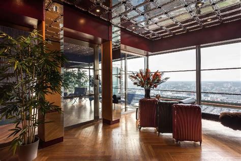 The clear glass balustrade makes this angular marble staircase appear to float, highlighted further by by the polished stainless steel trimming. Amsterdam Luxury Penthouse