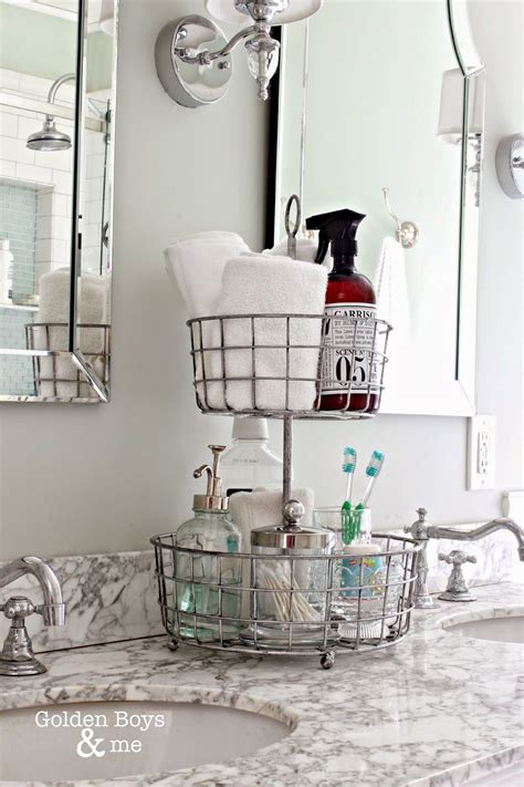 The white tiles match the tiled walls and keep the space feeling light and bright. Bathroom Countertop Storage Solutions With Aesthetic Charm