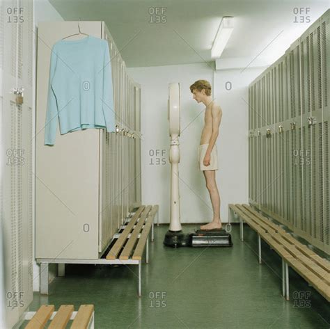 We did not find results for: A young man standing on a scale in a locker room stock ...