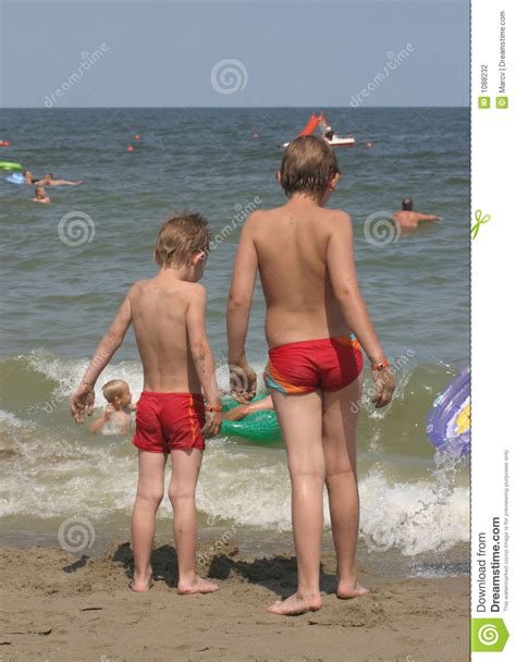 Old granny gang banged by young guys. Two Boys At The Beach, Staring At The Sea Stock Photo ...