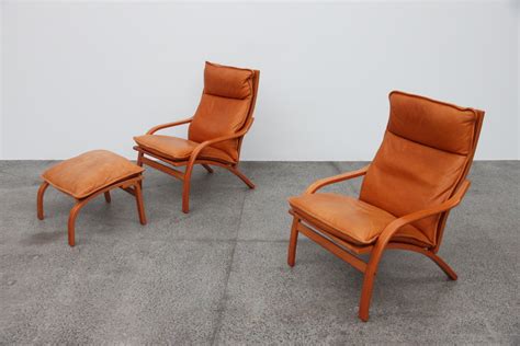 Flight delay compensation up to 600€: Pair of Tan Armchairs - The Vintage Shop