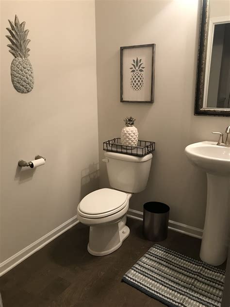 You can use shells that you have found in your beach travels or purchase a bag of shells at a craft store. Pineapple Themed Bathroom Decor - Natilittlethings