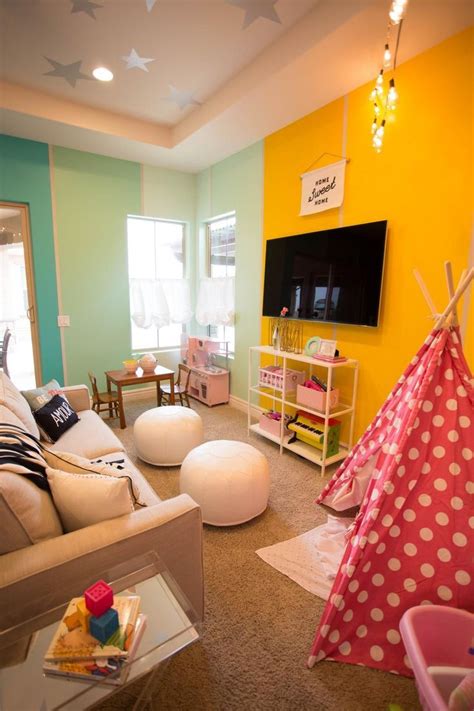 Tv stands and entertainment centers also make great additions to kids rooms. Small playroom with sofa, tv, child's table, child's ...