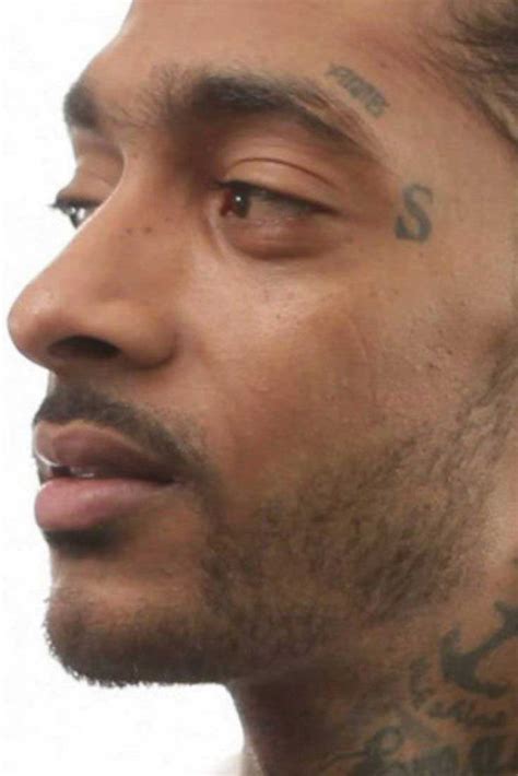 Nipsey hussle tattoo tmc tattoos marathon meaning death faces children body chest clothing son getty coroner update. Meanings behind Nipsey Hussle's Tattoos (New Images) - Also Celebrities with Nipsey Hussle ...