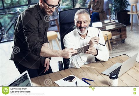 Place 1 tablespoon of water in a small plastic cup. Group Of Two Coworkers Making Great Time Brake During Work Process In Modern Office.Adult ...