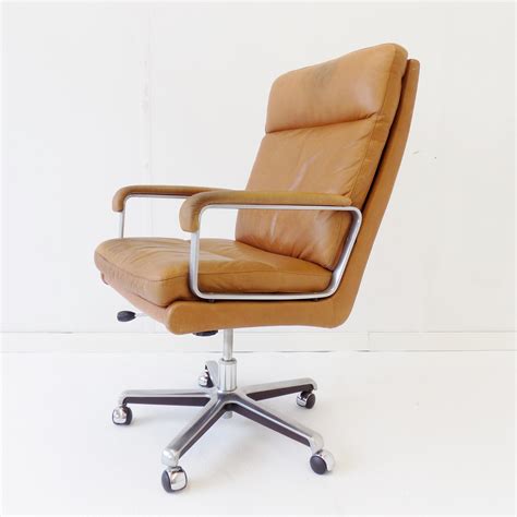 The chair is constructed of 100% leather with removable feather, fiber and down seat and. ES Eugen Schmidt caramel leather office chair | #137702