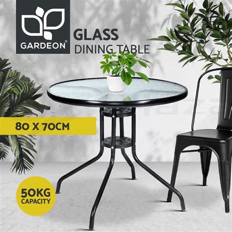 This round dining table offers a rustic finish emphasising the stunning natural wood grain. Gardeon Round Outdoor Dining Table Bar Setting Steel Glass Side Table 70CM 9350062280058 | eBay