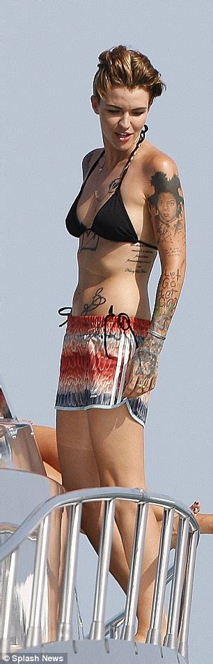 The model, actress, urban decay ambassadress, and lgbtq activist has worn every shade under the sun in an image posted to her instagram, ruby sits with her back to the camera, displaying quite a bit of new ink. Ruby Rose shows off her tattoos in black bikini in Ibiza ...