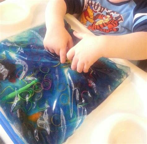 C loves watching the different objects move when he would push on the gel. Sensory bag made with hair gel, food coloring, plastic ...