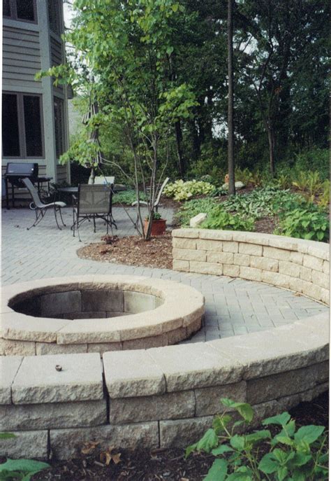 Stunning fire pit, retaining wall, outdoor fireplace, outdoor kitchen, paver patio in dublin oh and other areas nearby in columbus, ohio. Curved brick paver patio with fire pit, and retaining wall ...