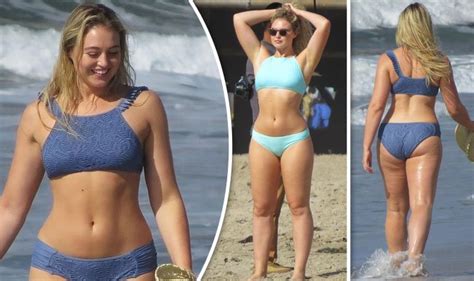 A mother hugs her son in an outdoor park in the sun at sunset. Iskra lawrence sizzles as she showcases her sexy curves in ...