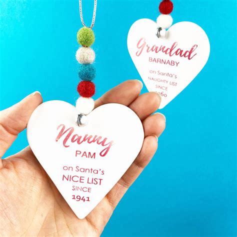Try handmade approach with christmas decorations as well: personalised 'naughty or nice' christmas decoration by ...
