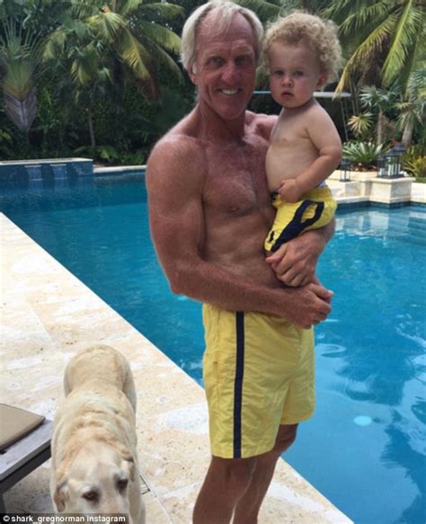 Greg norman, left, of australia, walks with his son greg norman jr. Greg Norman reveals his muscular midsection as he enjoys a ...