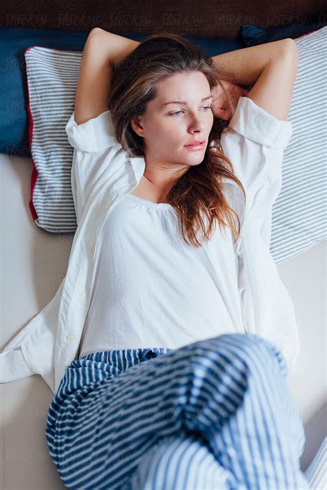 "Beautiful Woman Lying In Bed After She Wake Up" by Stocksy Contributor