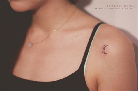 Maybe you would like to learn more about one of these? Small illustrative style moon tattoo on the left