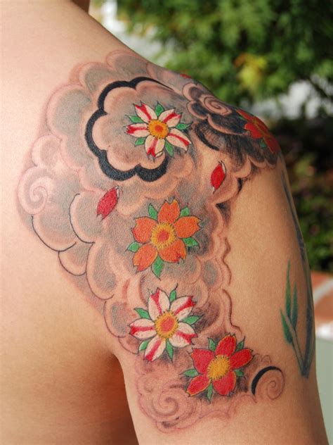 Asian lotus flower and buddha head tattoo on leg. Blossom Tattoo: Chinese, Japanese Flower Designs-12 Seductive Ideas | HubPages