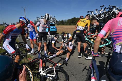 An imbecile fan caused this massive crash at the #tourdefrance2021 by holding a sign that jutted into the course and took. What Happens After a Crash at the Tour de France?