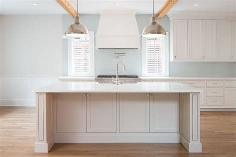 This kitchen from bella via design pairs pure white with lazy gray for a soft and subtle look. Kitchen cabinet paint color Sherwin Williams Snowbound Kitchen Isla… | Exterior house renovation ...