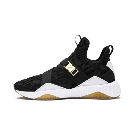 The puma defy mid varsity wn's has an upper made of fabric with polyurethane inserts with ankle strap for a sporty and elegant touch at the same time. Image 1 of Defy Varsity Mid Women's Sneakers, Puma Black ...