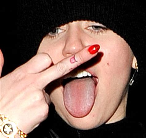 What appears to be a hole in your tongue is likely a harmless fissure or sore that doesn't require any treatment. Miley Cyrus Flips Photographer the Bird and Flashes New ...