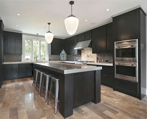 We love the combination of white kitchen cabinets with a lightly colored polished stone countertop (marble or granite) and a lightly colored tile flooring. The stainless steel countertop complements the dark ...