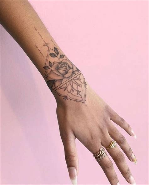 A mandala tattoo design can be small and simplistic, placed just on the small of the back. Mandala style | Wrist tattoos for women, Small wrist tattoos, Hand tattoos for women