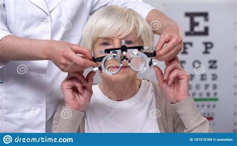 Optician Holding Phoropter, Preparing for Old Woman Vision Examination, Health Stock Image ...